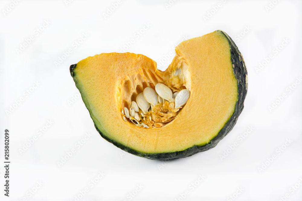 Raw pumpkin cut to pieces on white background Raw pumpkin cut to pieces on white background