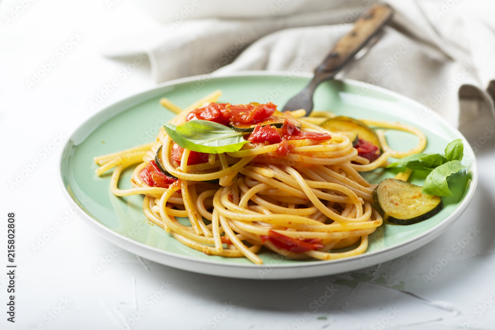 Traditional itaian spaghetti with tomato and zucchini