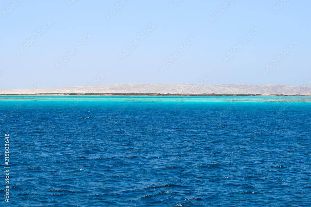 Obraz premium Mahmya island at Red Sea in Egypt, idyllic beach of Mahmya island with some boats in turquoise water, Egypt