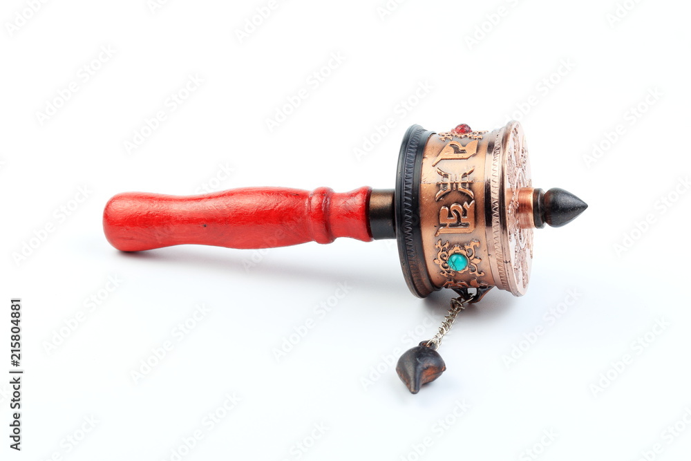 Tibetan Prayer wheel on white background, isolate. form Buddhist Temple of Bhutan. For increase good karma or lucky. Tibetan Prayer wheel on white background, isolate. form Buddhist Temple of Bhutan. For increase good karma or lucky.