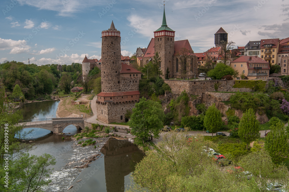 Fototapeta premium View to the Nuremberg tower near the river and bridge from the hill, panorama