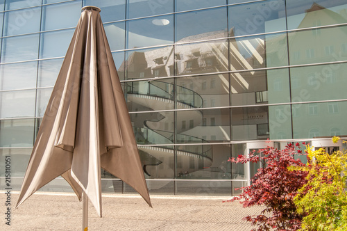 A large umbrella is made-up around a modern building
