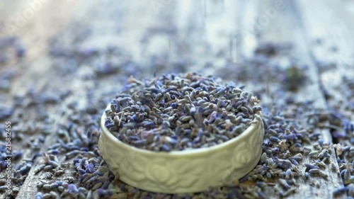 Small lavender flowers falling in a bowl