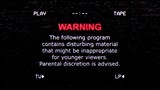 An old noisy VHS tape screen showing a warning message: the following program contains disturbing material, might be inappropriate for younger viewers; parental discretion is advised.
