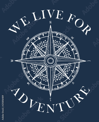 Hand-drawn vector banner with a wind rose and old nautical compass in retro style. Illustration on the theme of travel and discovery on the dark blue background with words We live for adventure