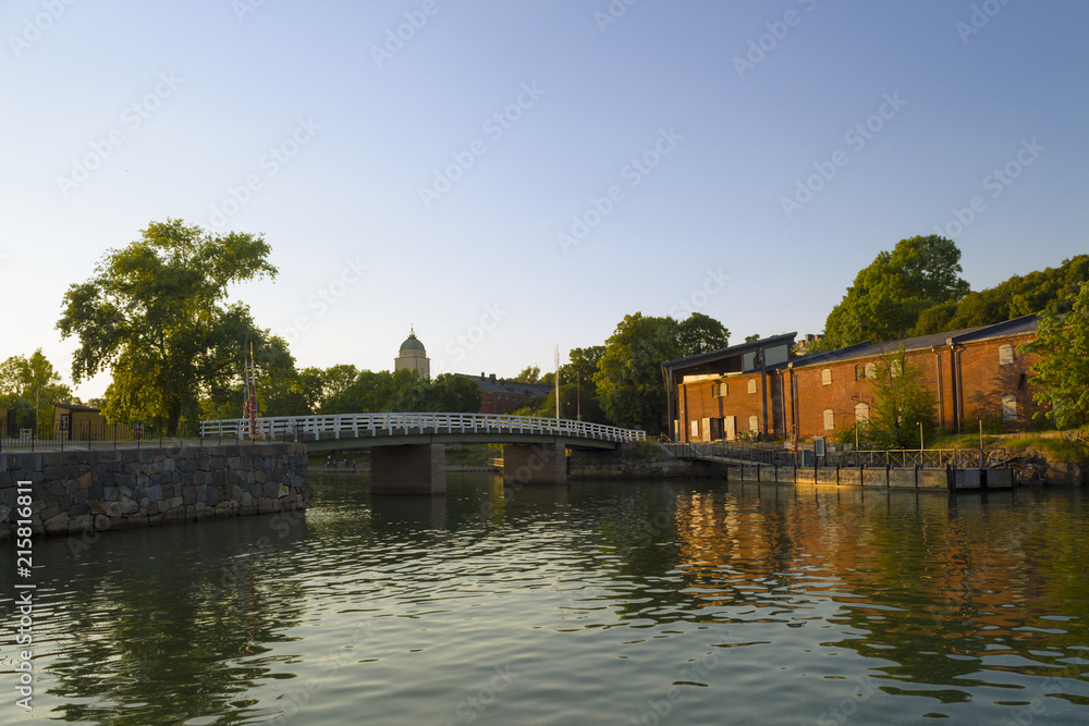 The wooden bridge connects parts of the ancient historical island-fortress Suominelinna, Sveaborg in the Gulf of Finland near Helsinki in Finland.