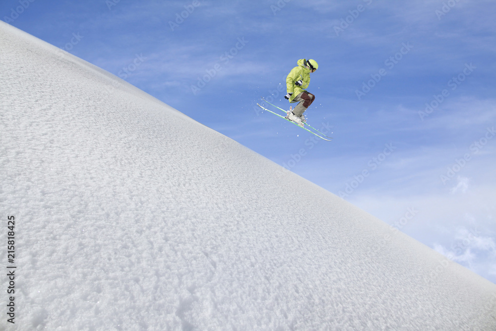 Flying skier on mountains. Extreme winter sport. Flying skier on mountains. Extreme winter sport.
