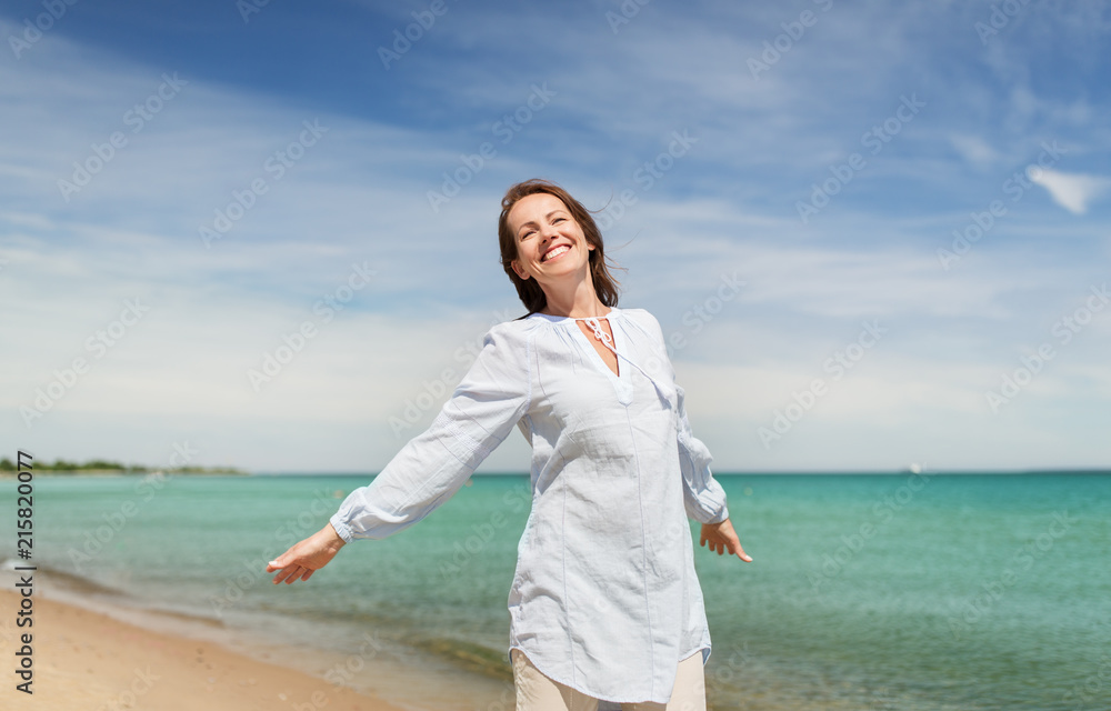 people and leisure concept - happy smiling woman on summer beach people and leisure concept - happy smiling woman on summer beach