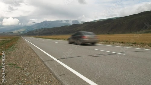 The car goes on the road to the steppe. Chuysky tract. Altai Republic.