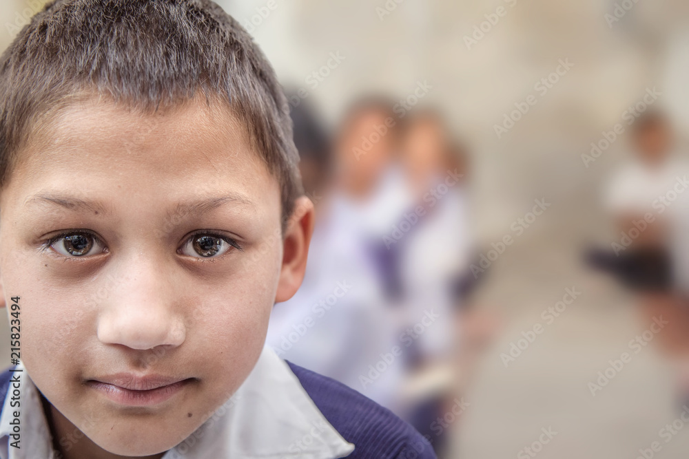 Portrait of smiling elementary Indian/Asian school Boy looking at camera. Portrait of smiling elementary Indian/Asian school Boy looking at camera.