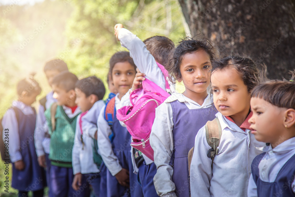 Rural Indian village school children standing outside class for morning prayer. Rural Indian village school children standing outside class for morning prayer.