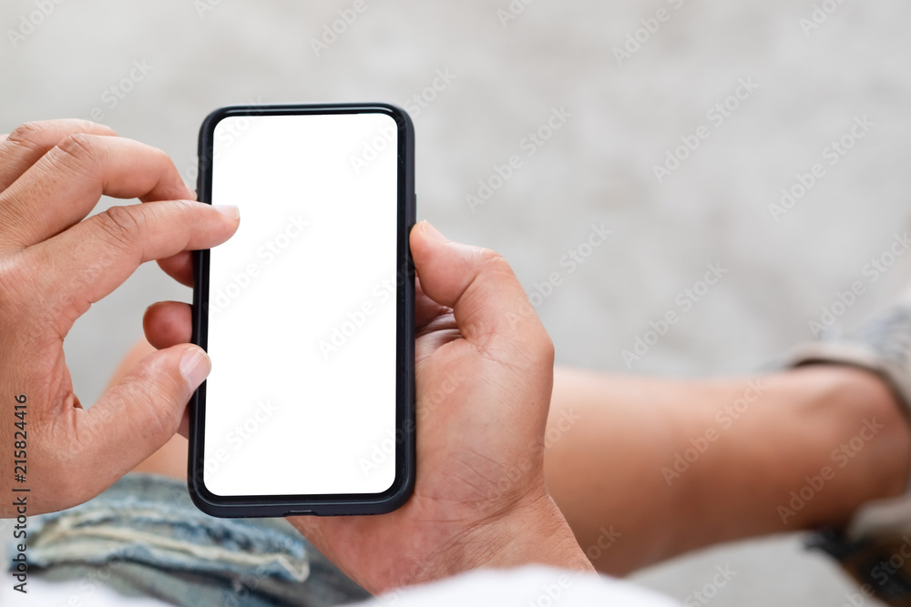 Man hands using mock up smartphone mobile is empty screen.