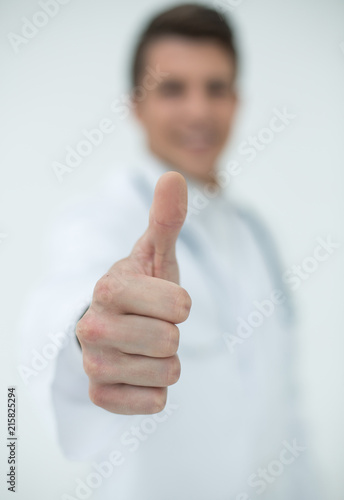 background image.a successful doctor showing thumbs up