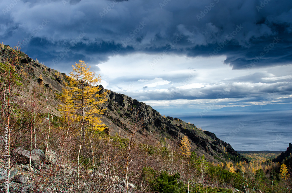 Sunny day at the mountains with colorfull clouds