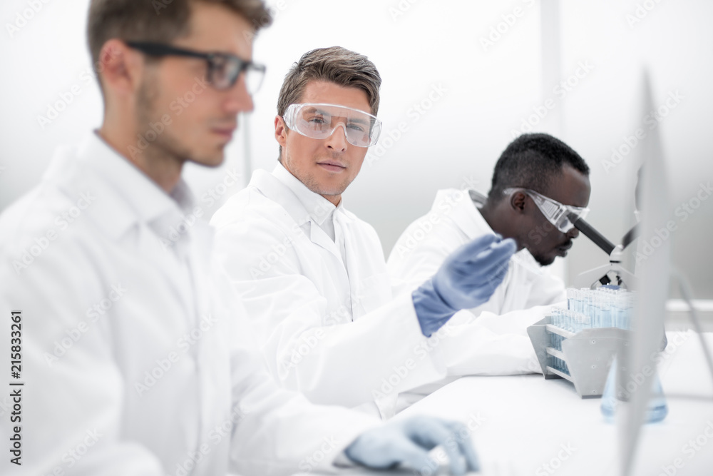 group of scientists are discussing new achievements group of scientists are discussing new achievements