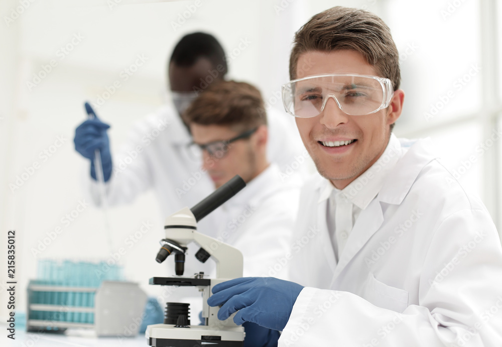 group of young scientists working with liquids group of young scientists working with liquids