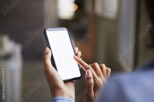 Close up of womanÕs hands using smartphone touchscreen