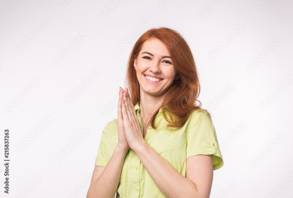 Young redhead woman clapping her hands on white background Young redhead woman clapping her hands on white background