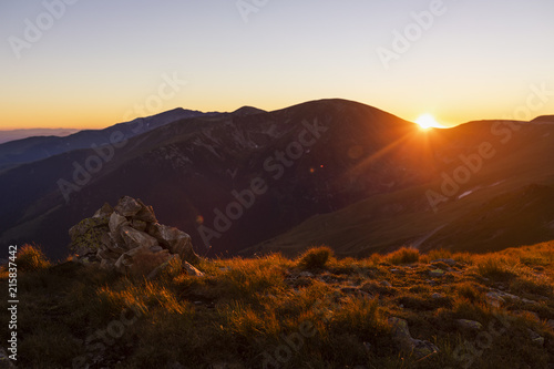 Landscape with beautiful sunset on top of the mountains