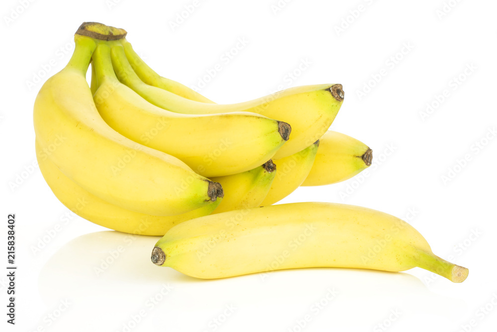 Lot of whole fresh yellow banana one cluster with separated banana isolated on white background