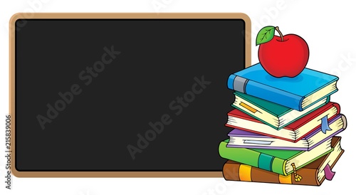 Stack of books and blackboard