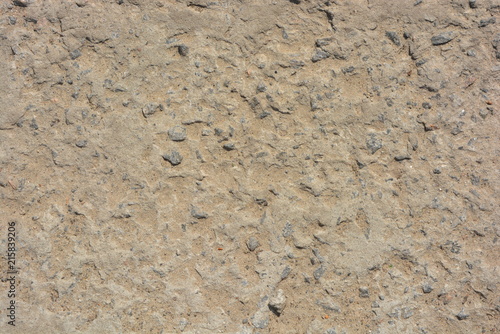 Yellow concrete background of gravel and sand, concrete steps