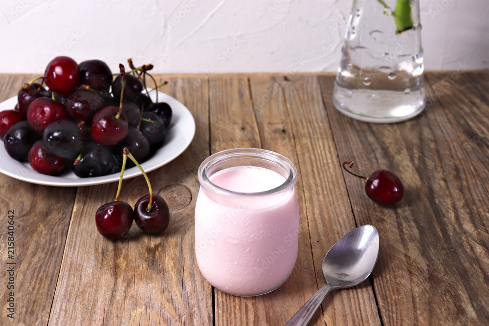 Cherry yogurt in glass, with fresh cherries Cherry yogurt in glass, with fresh cherries