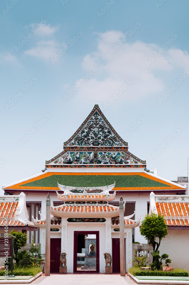 Naklejka premium Chinese inspired Main hall architecture and gate of Wat Ratchaorotsaram temple Bangkok