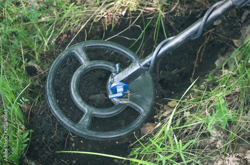 Metal detector. Treasure hunting concept. In searching of ancient relics.