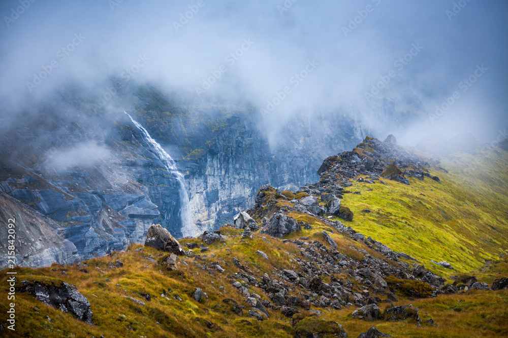 Water falling from a mountain glacier on the Annapurna range into the moraine at the lush and green Annapurna Base camp. Water falling from a mountain glacier on the Annapurna range into the moraine at the lush and green Annapurna Base camp.