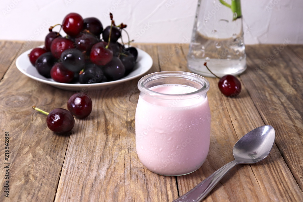 Cherry yogurt in glass, with fresh cherries Cherry yogurt in glass, with fresh cherries
