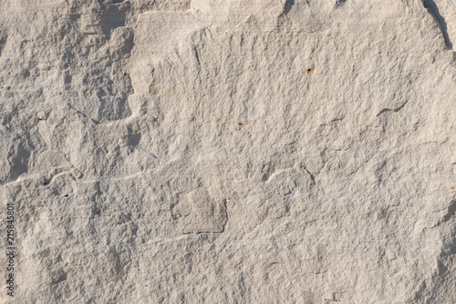 Background geology closeup limestone rock face showing weathered strata wallpaper photo