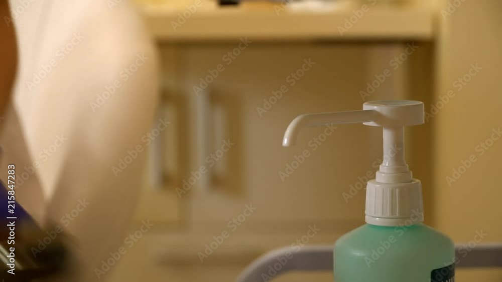 fight dripping liquid soap on a cotton pad. hospital. plastic surgery. disinfection. fight dripping liquid soap on a cotton pad. hospital. plastic surgery. disinfection.
