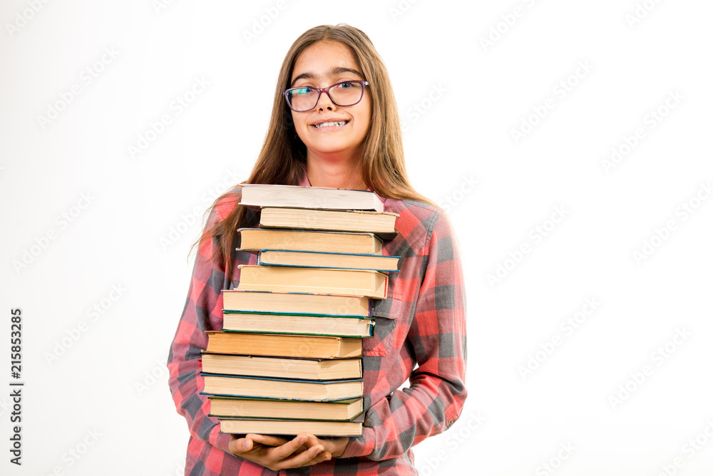 Girl with many books. A student holds a large stack of books. Ubcheba at school. Library. Beginning of studies at the Institute. Young girl with a book in glasses
Girl with many books. A student holds a large stack of books. Ubcheba at school. Library. Beginning of studies at the Institute. Young girl with a book in glasses