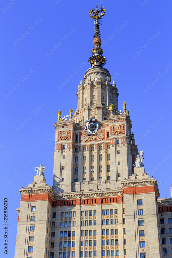 Tower of Lomonosov Moscow State University (MSU) in sunny summer evening on a blue sky background