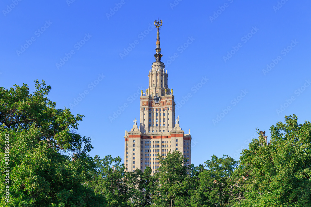 Moscow State University (MSU) on a blue sky background in sunny summer evening