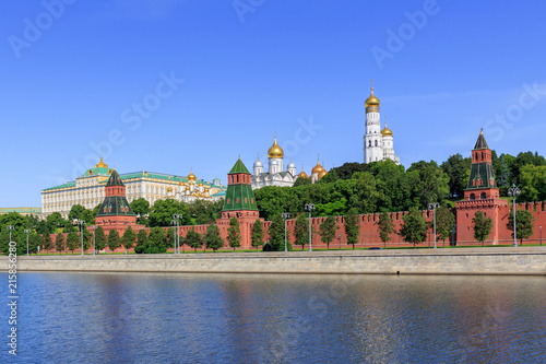 Moscow Kremlin on a Moskva river background against blue sky in sunny summer morning