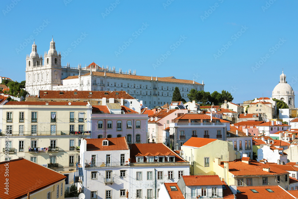 Alfama old district with Monastery of Sao Vicente de Fora with dome of Santa Engracia in a beautiful summer day in Lisbon, Portugal
