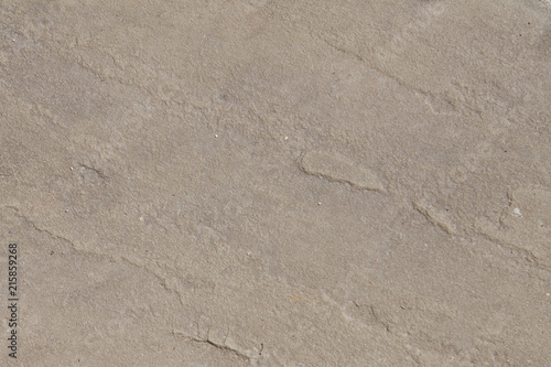 Smooth flat pink stone wall surface with small defects