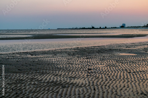 Low tide on the Gulf at sunset