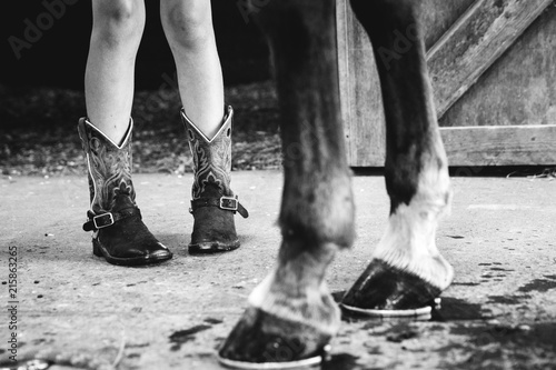 girl feet and horse hooves