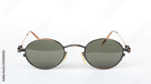 Old sunglasses with metal frame in steampunk style on a white background