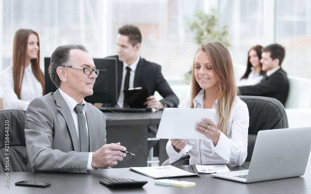 employees using digital tablet to work with financial data employees using digital tablet to work with financial data