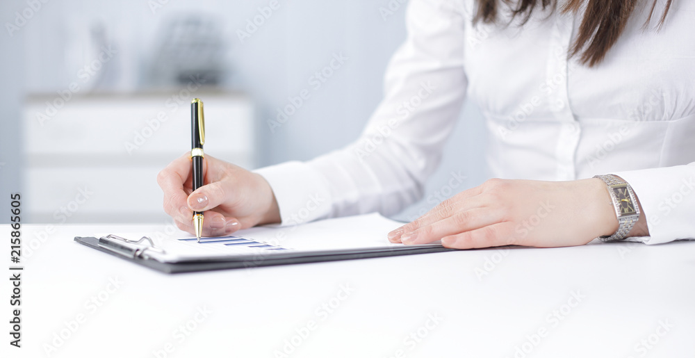 business woman analyzing the financial schedule business woman analyzing the financial schedule