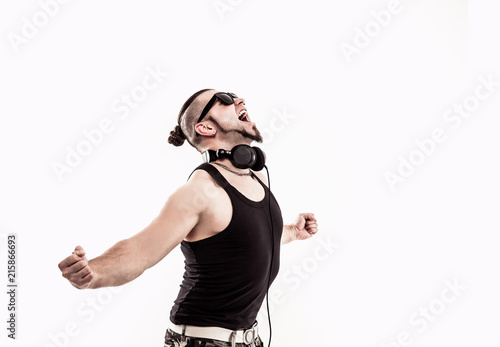 emotional and charismatic DJ - rapper in headphones takes the ra