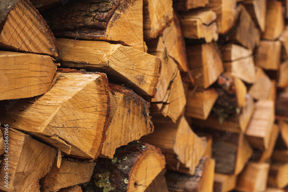 .Stacks of Firewood. Preparation of firewood for the winter..Pile of Firewood.Firewood background .Stacks of Firewood. Preparation of firewood for the winter..Pile of Firewood.Firewood background