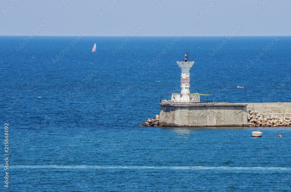Russia, the peninsula of Crimea, the city of Sevastopol. 06/10/2018: Lighthouse at the entrance to the Sevastopol Bay