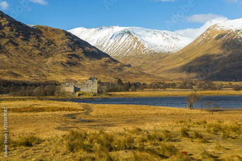 The ruins of Kilchurn Castle seen across Loch Awe in winter, Kilchurn Bay, Loch Awe, Argyll and Bute, Highlands, Scotland photo