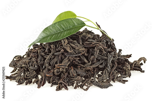 Dried black tea with green leaves isolated on white background