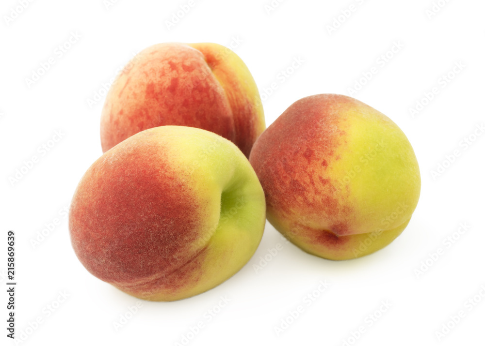 Freshly picked peaches close-up on a white background Freshly picked peaches close-up on a white background